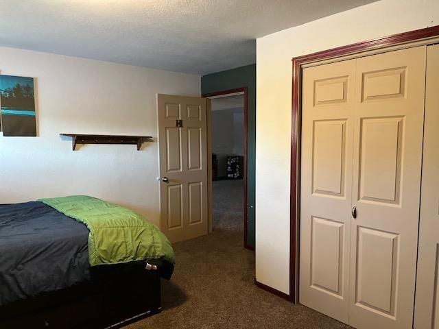 carpeted bedroom with a closet