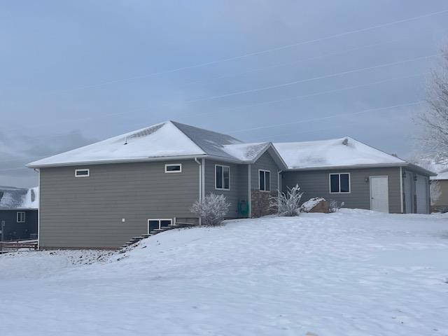 view of snow covered house