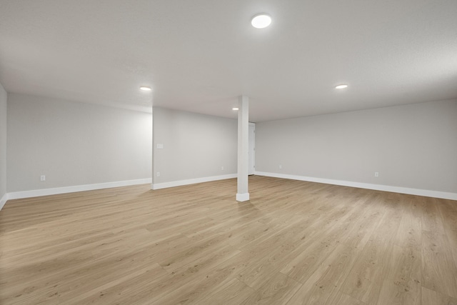 basement featuring light hardwood / wood-style flooring