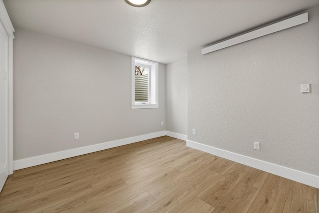 unfurnished room featuring light hardwood / wood-style flooring