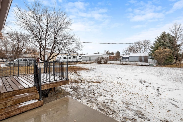 view of yard layered in snow