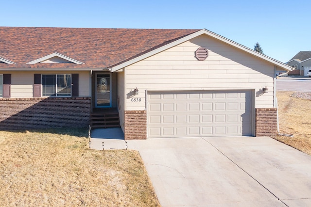 ranch-style home featuring a garage