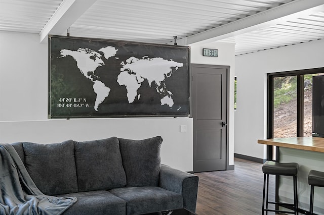 living room with wood-type flooring and beam ceiling