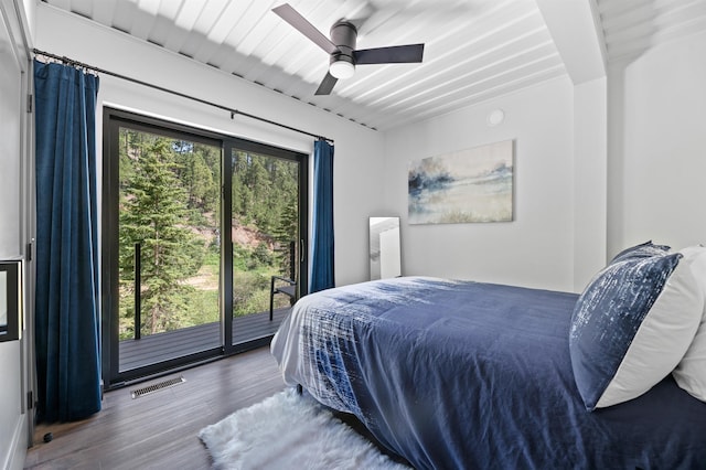 bedroom featuring dark wood-type flooring, ceiling fan, and access to exterior