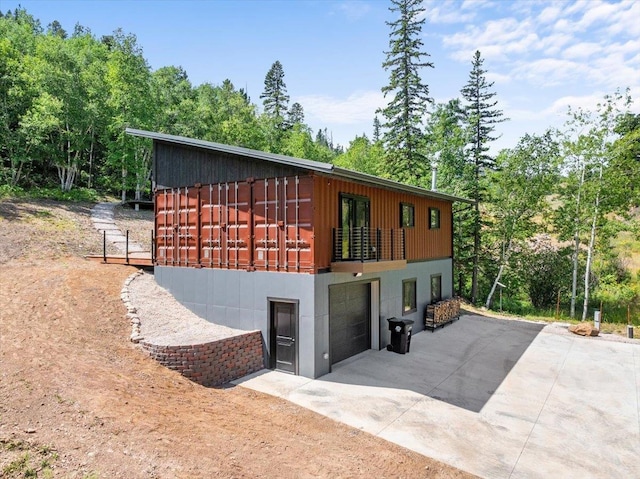 view of side of property featuring a garage