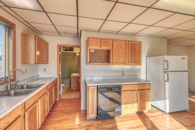 kitchen with wine cooler, sink, light hardwood / wood-style flooring, and white refrigerator