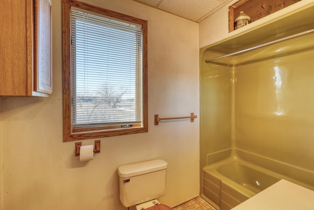 bathroom with shower / bath combination and toilet