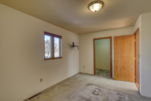 unfurnished bedroom with light carpet