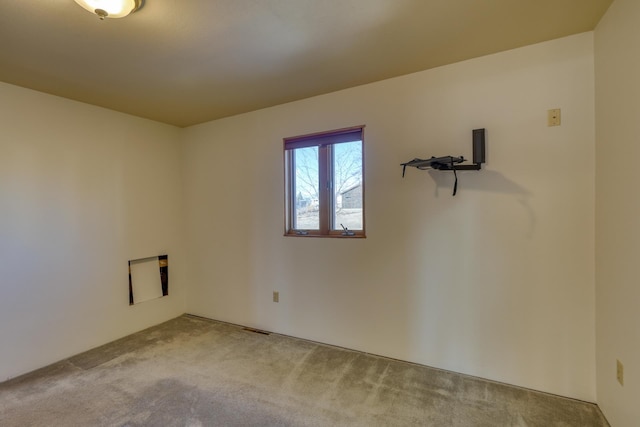 empty room featuring light colored carpet