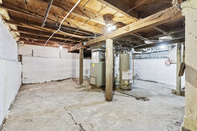 basement featuring water heater and heating unit