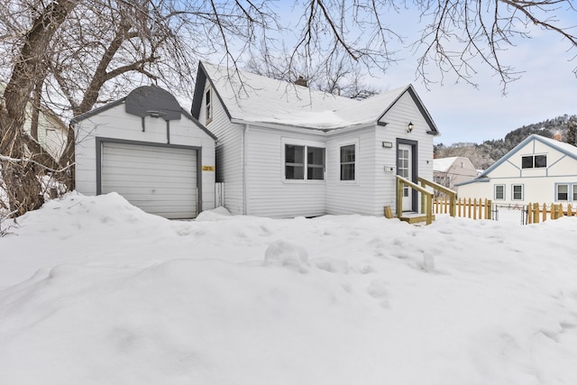 view of front of property featuring an outbuilding and a garage