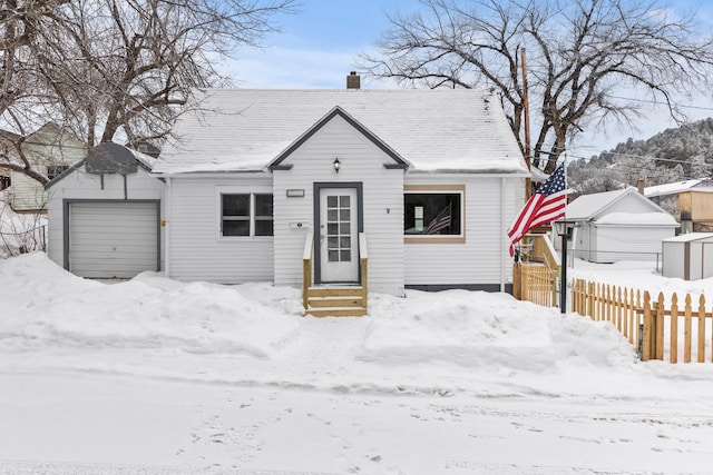 bungalow-style house featuring a garage