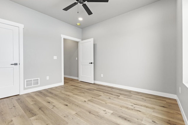 spare room with light hardwood / wood-style floors and ceiling fan