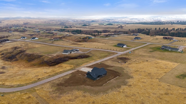 birds eye view of property with a rural view