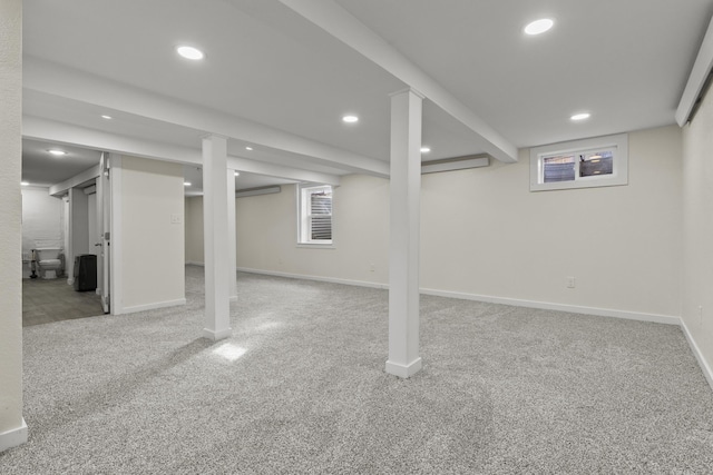 basement featuring light carpet