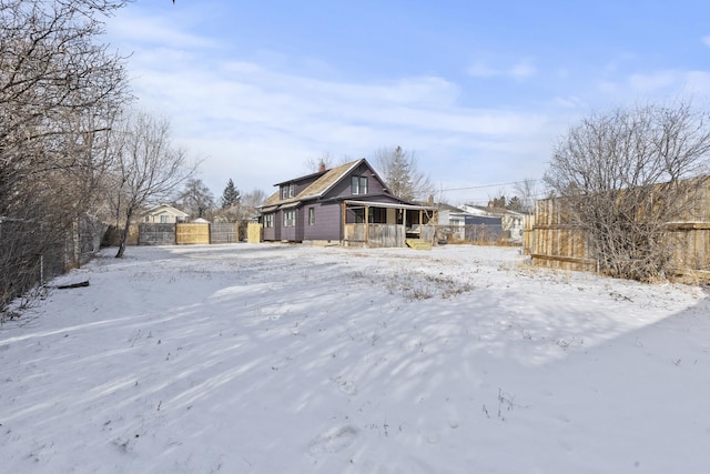 view of yard layered in snow