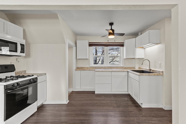 kitchen with white cabinetry, sink, and range with gas stovetop