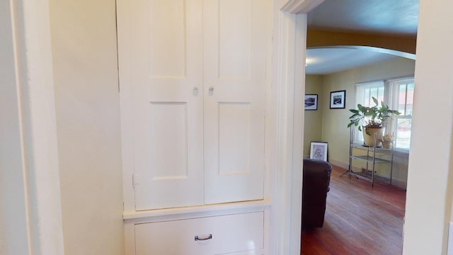133 Pine Ave, Hill City, SD 57745 - corridor featuring arched walkways, wood finished floors, and baseboards