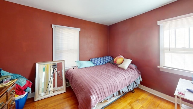 133 Pine Ave, Hill City, SD 57745 - bedroom featuring wood finished floors and baseboards