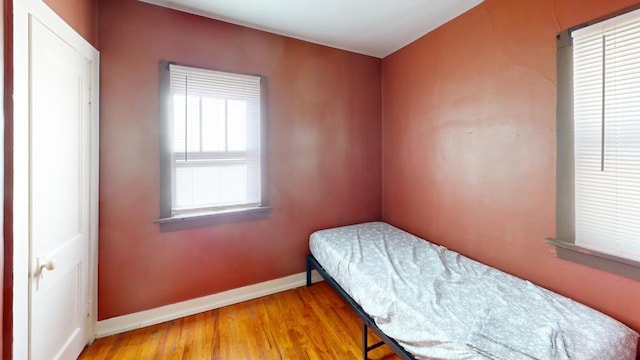 133 Pine Ave, Hill City, SD 57745 - bedroom with baseboards and wood finished floors