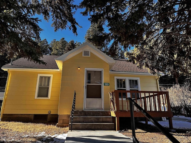 133 Pine Ave, Hill City, SD 57745 - view of front facade featuring a shingled roof, entry steps, and a wooden deck
