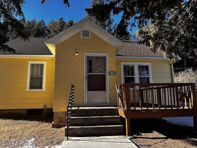 133 Pine Ave, Hill City, SD 57745 - view of front of home with roof with shingles and a wooden deck