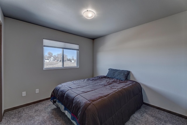 bedroom with light colored carpet