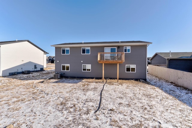 rear view of property featuring cooling unit