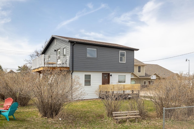 rear view of house with a yard