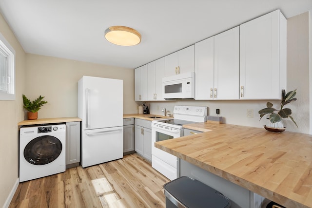 kitchen featuring white cabinetry, washer / clothes dryer, white appliances, and wooden counters