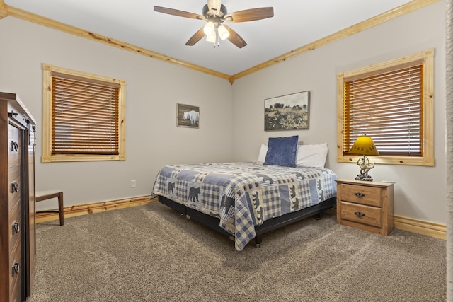 bedroom with crown molding, ceiling fan, and carpet