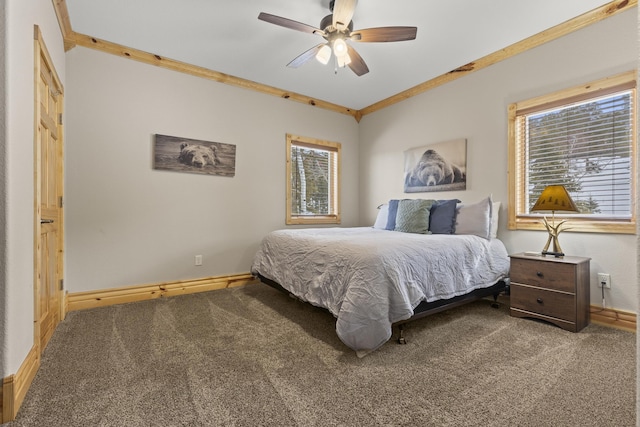 bedroom featuring ornamental molding, ceiling fan, and carpet