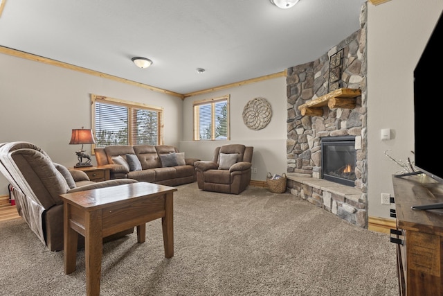 carpeted living room with crown molding and a fireplace