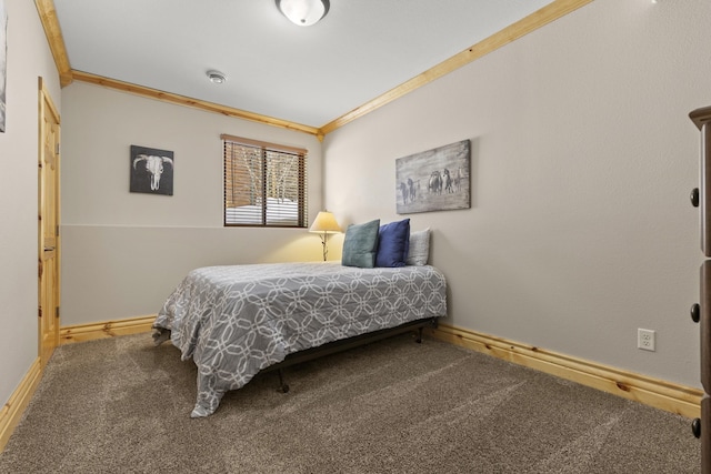 bedroom featuring ornamental molding, carpet flooring, and baseboards