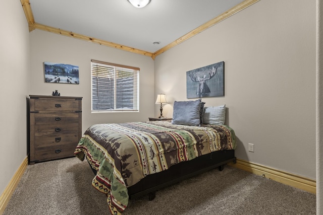 carpeted bedroom featuring ornamental molding and baseboards