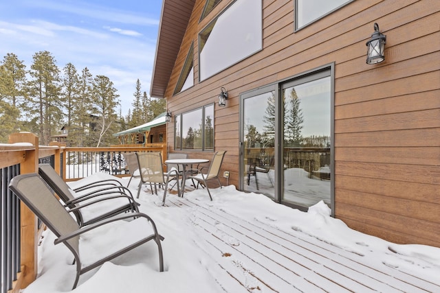 view of snow covered deck