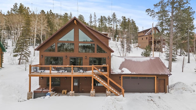 view of front of home featuring a wooden deck and a garage