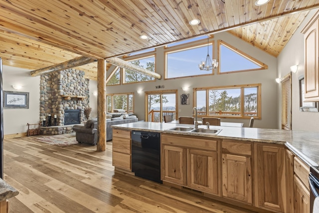 kitchen with light wood-style flooring, wood ceiling, a sink, a stone fireplace, and dishwasher