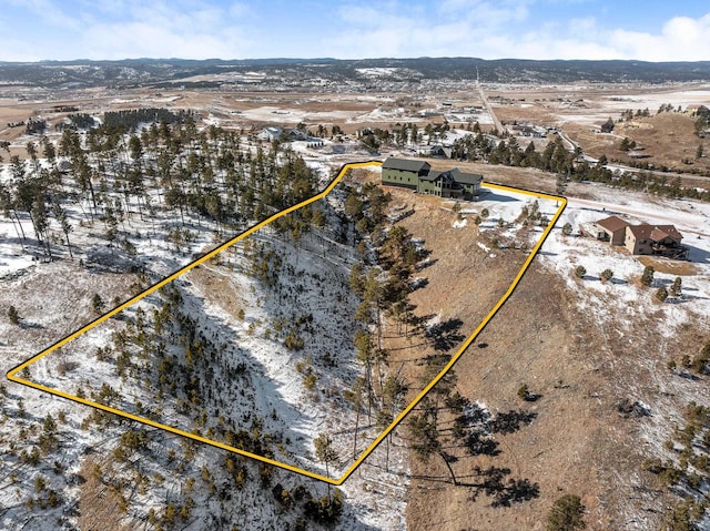 7102 Marvel Mountain Rdg, Rapid City, SD 57702 - snowy aerial view with a mountain view