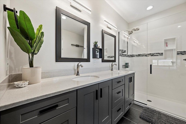 bathroom with vanity, tile patterned floors, and walk in shower