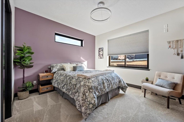 carpeted bedroom with a textured ceiling