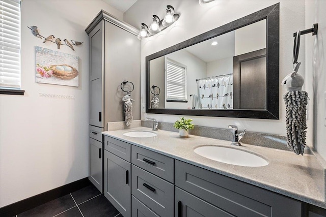 bathroom featuring a shower with shower curtain, vanity, and tile patterned flooring