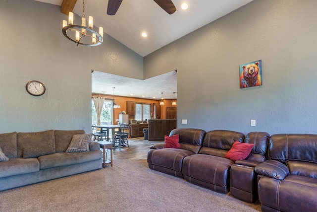 cinema room featuring wood-type flooring, high vaulted ceiling, ceiling fan with notable chandelier, and beam ceiling