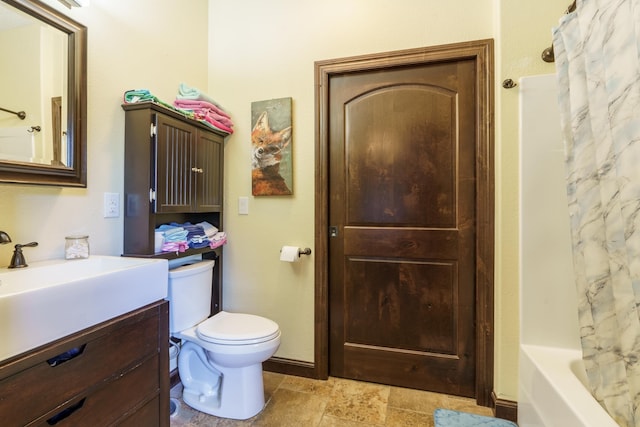 full bathroom featuring shower / bath combination with curtain, vanity, and toilet