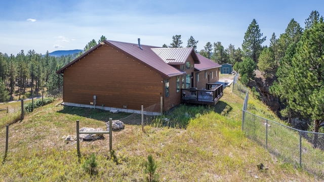 view of home's exterior with a deck