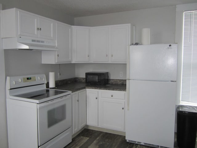 kitchen featuring white appliances, dark hardwood / wood-style flooring, a textured ceiling, and white cabinets