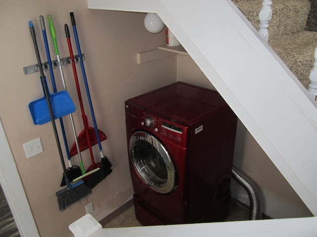 washroom with washer / dryer