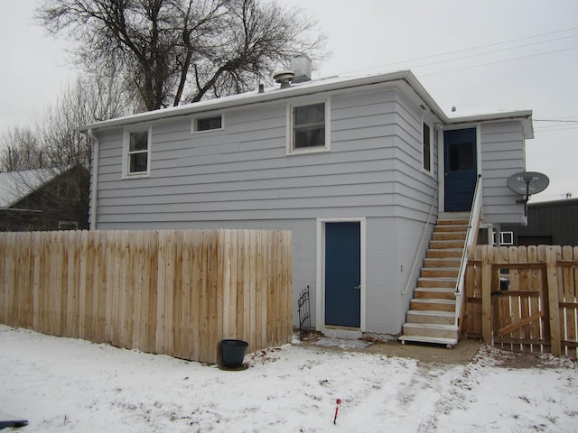 view of snow covered house