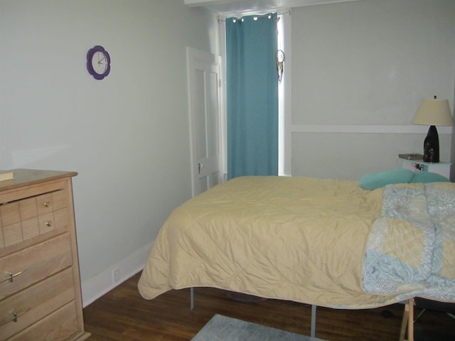 bedroom featuring dark wood-type flooring