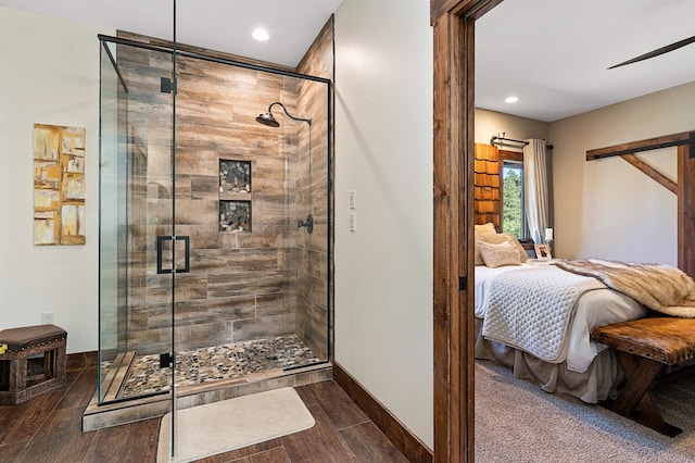 bathroom with a shower with shower door